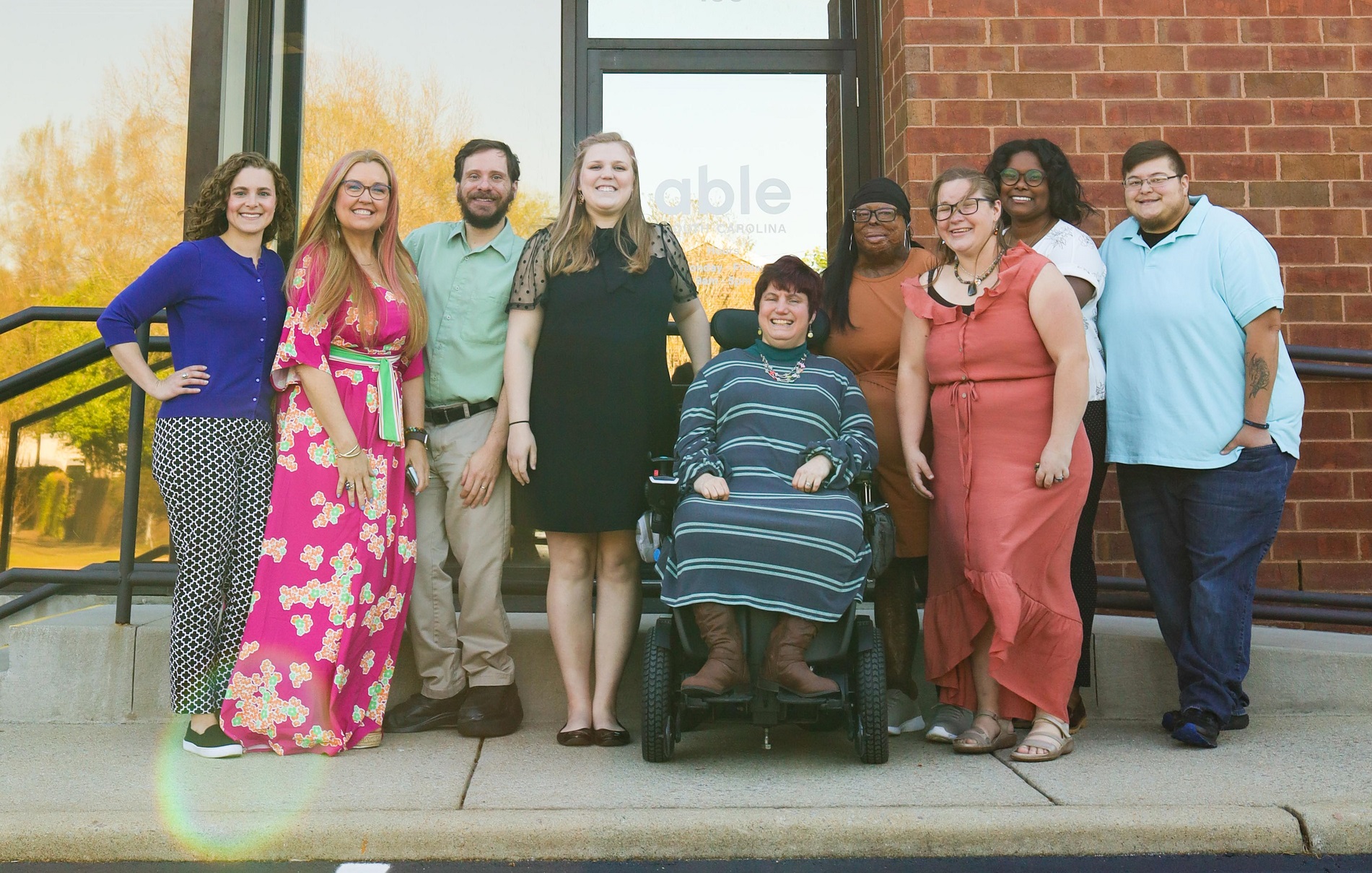 Able SC staff smile outside for a photo.